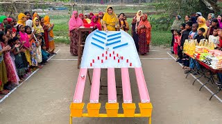 Everyone winning in fun game. New place & new fun challenge for village women