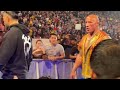 The Rock feeling the sweet Cody slap off air as he exit ringside with Roman reigns on WWE SMACKDOWN