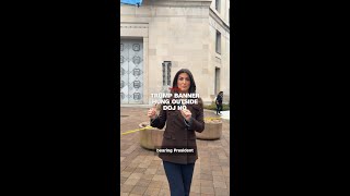 Trump banner hung outside DOJ HQ Guide
