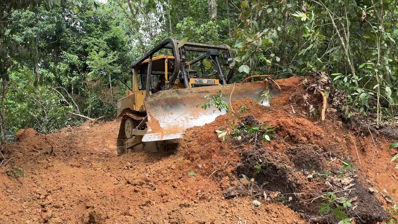 The Work on the Mount Bulldozer D6R XL Road Is Widening the Road Body.