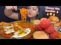 Cheesy samyang fire noodles with rice cakes  cheetos chicken drumsticks and chicken burgers  eggs