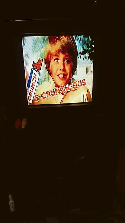 1980s nestle crunch commercial on old tv
