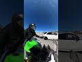 Biker is trying to hand off his girlfriend&#39;s hair clip to his buddy in the car!