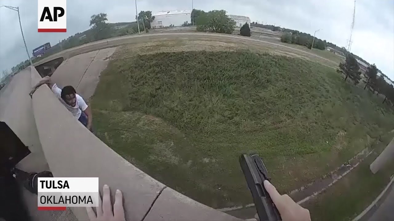 breaking free Man being chased by officers falls from bridge