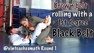 Brown belt rolling with a 1st degree Black Belt