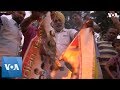 Indian cricket fans burn posters in reaction to world cup loss