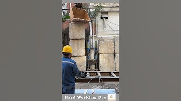 The Process Of Driving A Pole Into The Ground