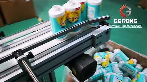 Oval bottle switch type robot hand feeding positioning labeling machine