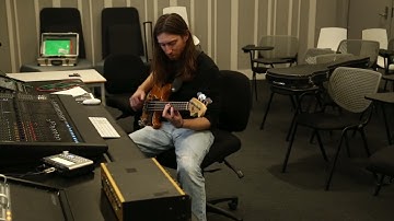 Bass Player Alex King recording basslines to "Svengali" live at UWS isolation studios,