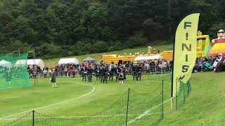 Massed pipes & drums in Forres Highland games 2019