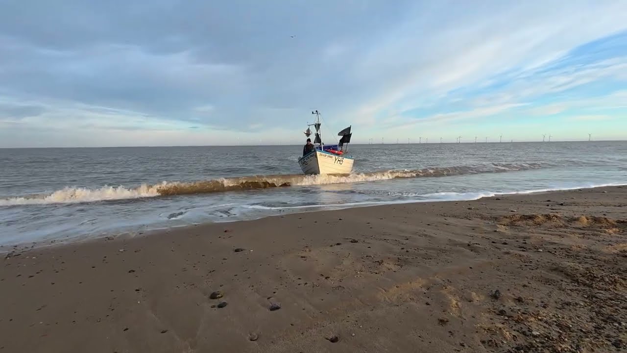 All the debris on the beach & watching dad come ashore, the first herring fishing trip of the year.