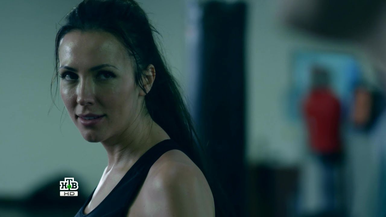 Crime boss lady debriefs her henchmen and beats one of them in the ring