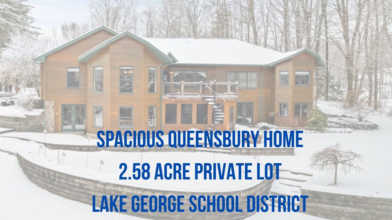JUST LISTED Spacious Queensbury home on 2.58 acre private lot in Lake