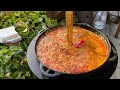 Fried Rural BORSCH In A Cauldron On Wood Even The Spoon Is Standing