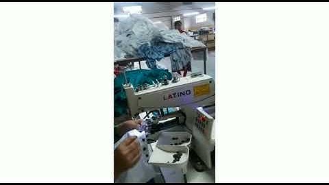 Latino direct drive button attaching machine.