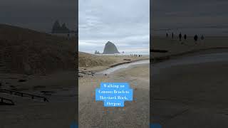 Walking on Cannon Beach in Oregon to the Haystack Rock formation