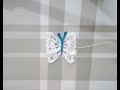 Mariposa decorativa tejida a crochet con hilo de algodón