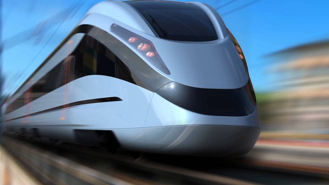 Un treno ad alta velocà che sfuma sui binari al tramonto | Immagine