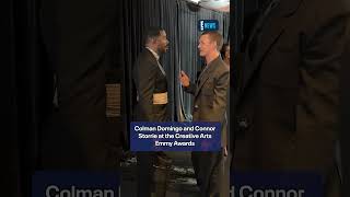 Colman Domingo and Connor Storrie pose for pictures backstage at the Creative Arts Emmy Awards.