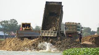 Powerful and Impressive Machines Heavy Bulldozer Pushing Dirt and Dump Truck Unloading Dirt