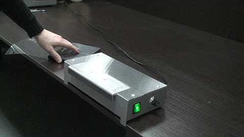 Delta200s manual overwrapping machine for pre-cut sheets.