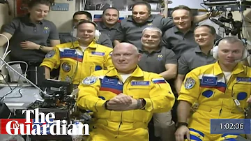 Russian cosmonauts board ISS wearing colours of Ukraine flag