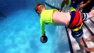 Dragged Down to the Bottom of the Swimming Pool with a 20 Pound Rubber Bell Weight