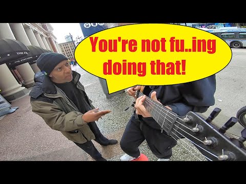 Busker Has Best Reaction After Being Accused Of Faking Guitar Solo