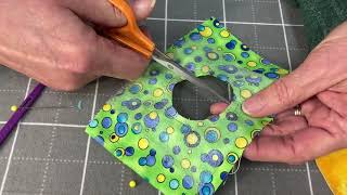 learn about reverse appliqué for quilting, and how to make easy perfect circles for applique.