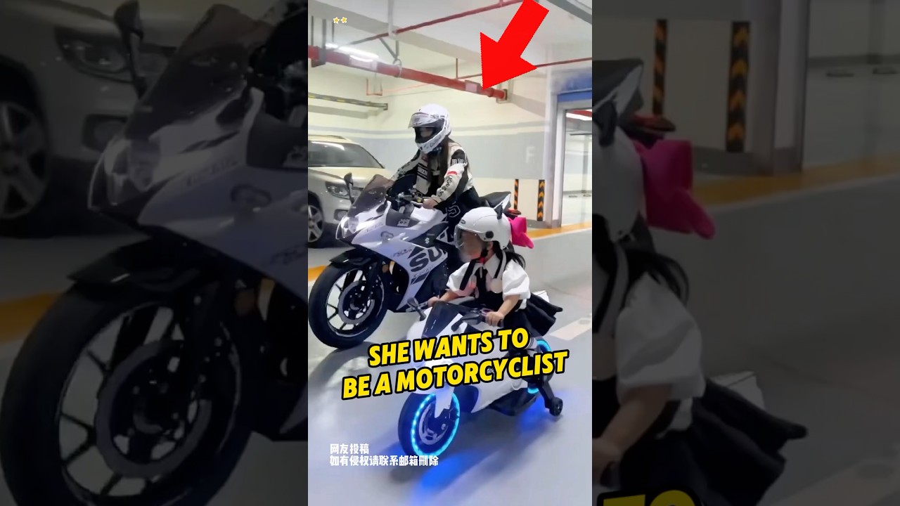 She is working hard to learn how to ride a motorcycle
