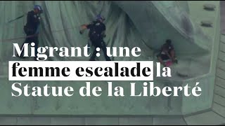 Une femme escalade la Statue de la Liberté contre la politique migratoire de Trump