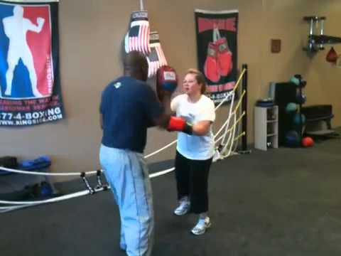 Coach Kenny showing Shaina Hammerman different mov...