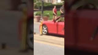 Red Porsche crossing railroad tracks in Kirkwood MO