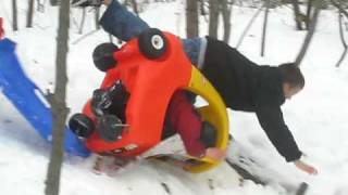 kid on car+sled wipeouts