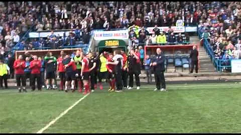 Flitcroft addressing the stadium and...