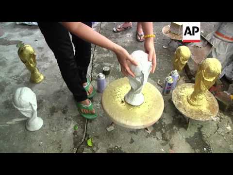 pottery-craftsman-gains-popularity-with-his-ceramic-replica-of-the-golden-world-cup-trophy