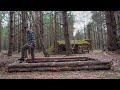 Log cabin in the woods: raised bed for vegetables, relexing shelter, off grid shelter