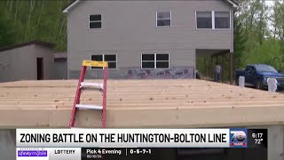 Huntington man moving his house 12 feet to comply with zoning rules