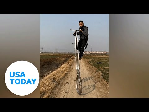 Crazy video shows talented man climbing, riding bike over 9 feet tall | USA TODAY