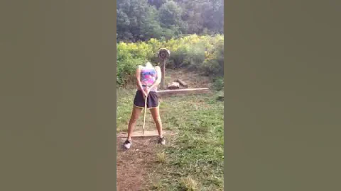 Lumberjill axe throw trick shot