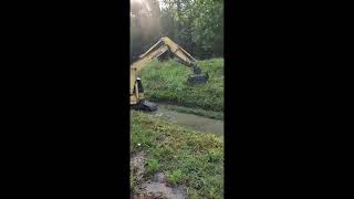 Cutting The Plant Growth Along Sawmill Trace Creek