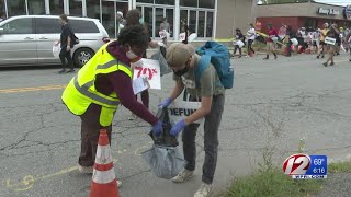 Local activists spreading their message while cleaning up the streets of Providence
