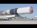 SpaceX Falcon 9 booster B1052-2 rives by the press site
