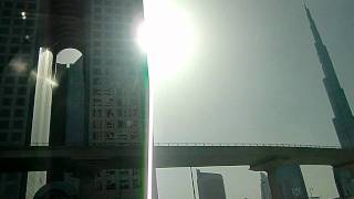 sheikh zayed road in a taxi, business bay, burj khalifa, emirates towers and world trade center screenshot 2
