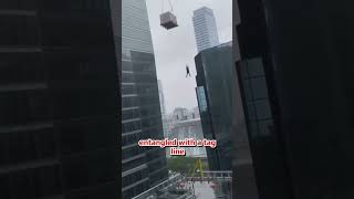 Toronto man dangles from a crane.. ?