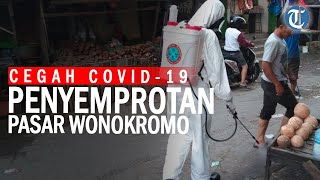 Tim kimia biologi radioaktif polda jatim blusukan ke pasar semprot
disinfektan