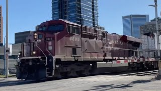 CP stack train wth shiny new painted ac4400cwm and smoky ac44 leaving Calgary downtown on laggan sub