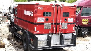 Armored Trucks in a Junkyard