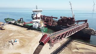 DC Orisant Hopper Dredger Vessel unloading gravel at Thyborøn Nordsøral - Fast Process Big Industry Net Worth