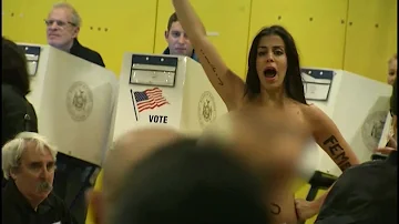 Topless protesters crash Donald Trump's polling place